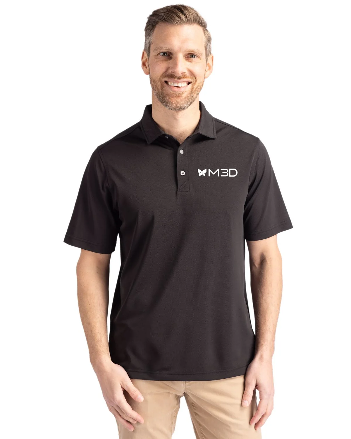 White M3D logo applied to the left chest of a black polo shirt