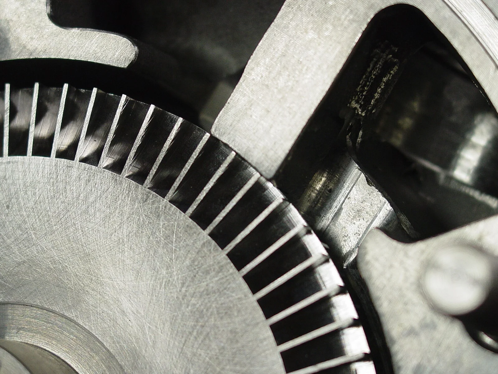 Close-up of a machined impeller with curved, overlapping vanes, the kind of organic geometry that needs simultaneous 5-axis machining.